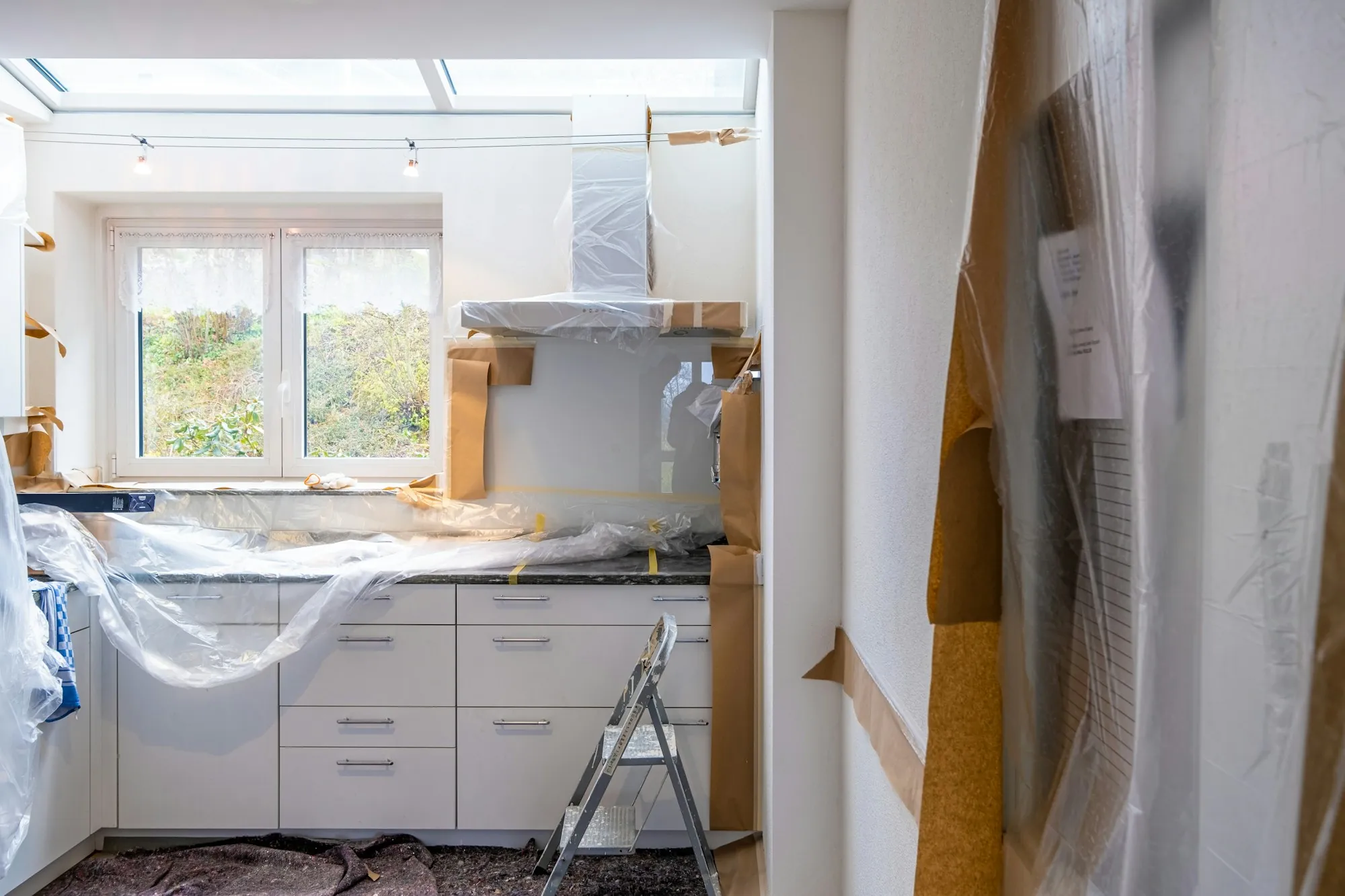 Kitchen under renovation with cabinets going in
