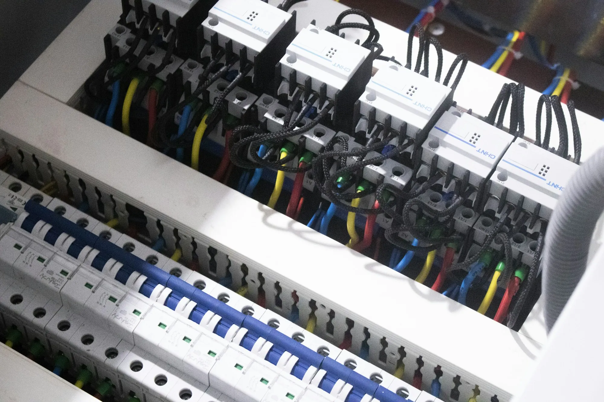 Close view of breakers inside an electrical panel